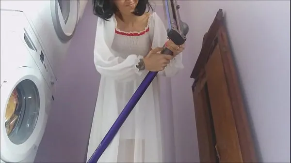 Grote Chantal is a good housewife but sometimes she lingers too much with the vacuum cleaner totale buis